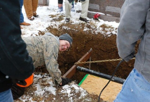 Biker Buried Riding His Harley Davidson