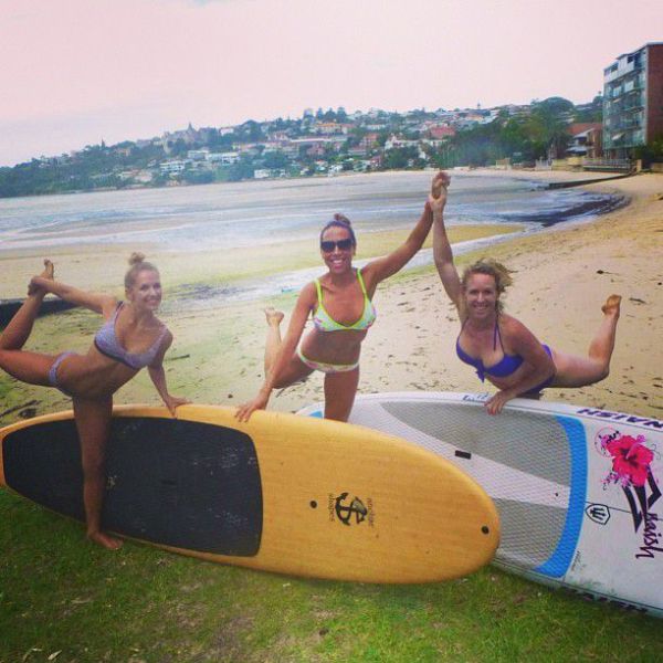 Surfboard Yoga Is a Fun New Form of Beach Exercise