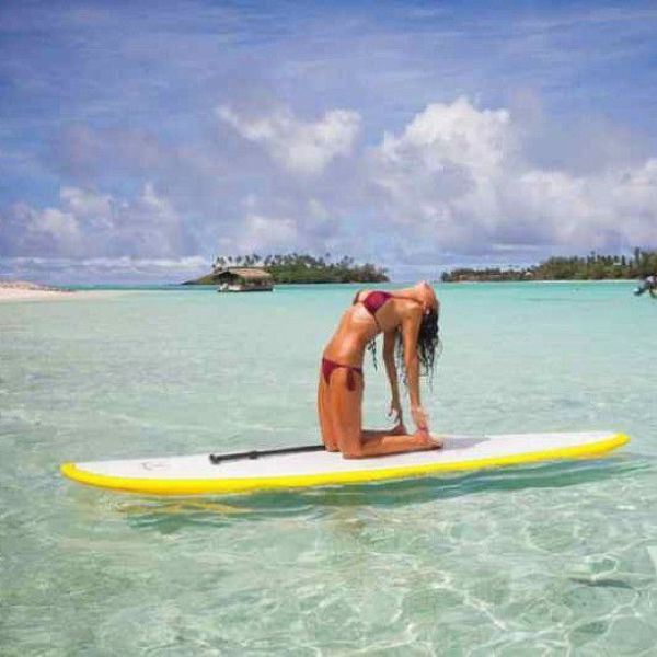 Surfboard Yoga Is a Fun New Form of Beach Exercise