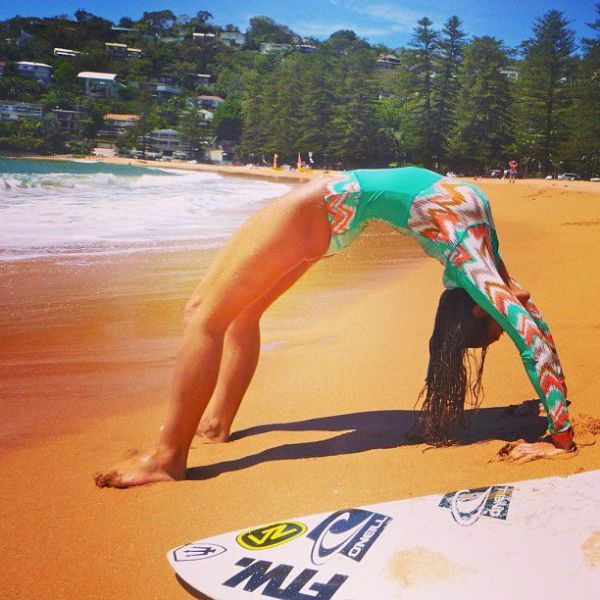 Surfboard Yoga Is a Fun New Form of Beach Exercise