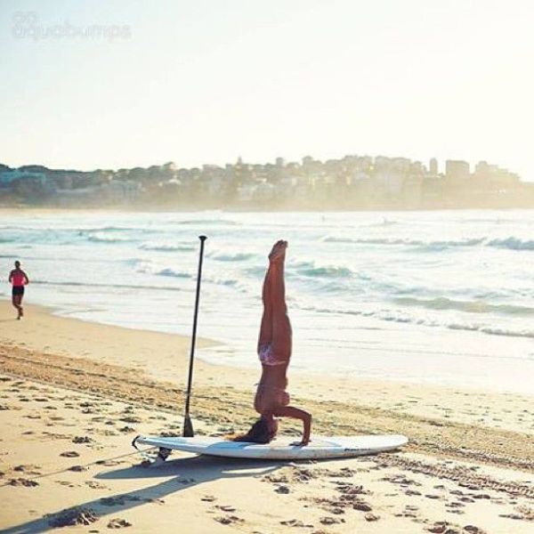 Surfboard Yoga Is a Fun New Form of Beach Exercise