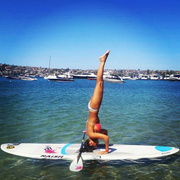 Surfboard Yoga Is a Fun New Form of Beach Exercise