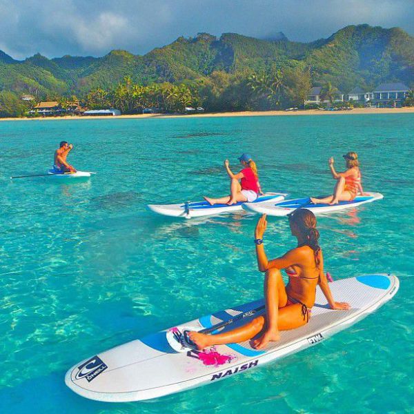 Surfboard Yoga Is a Fun New Form of Beach Exercise
