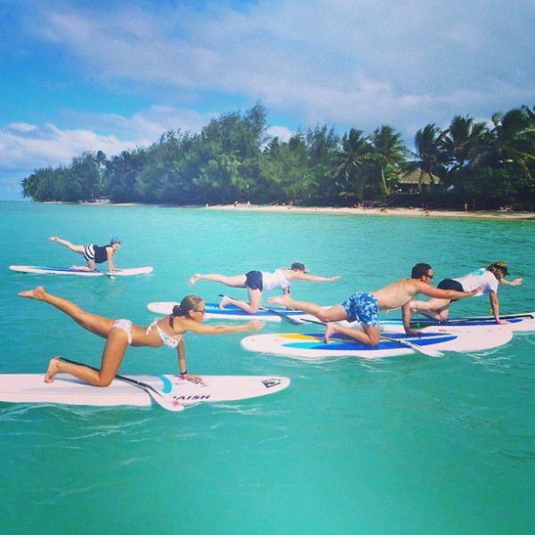Surfboard Yoga Is a Fun New Form of Beach Exercise