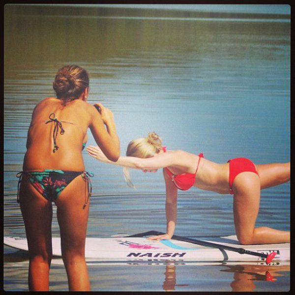 Surfboard Yoga Is a Fun New Form of Beach Exercise