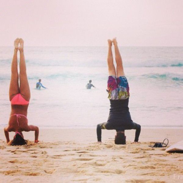 Surfboard Yoga Is a Fun New Form of Beach Exercise
