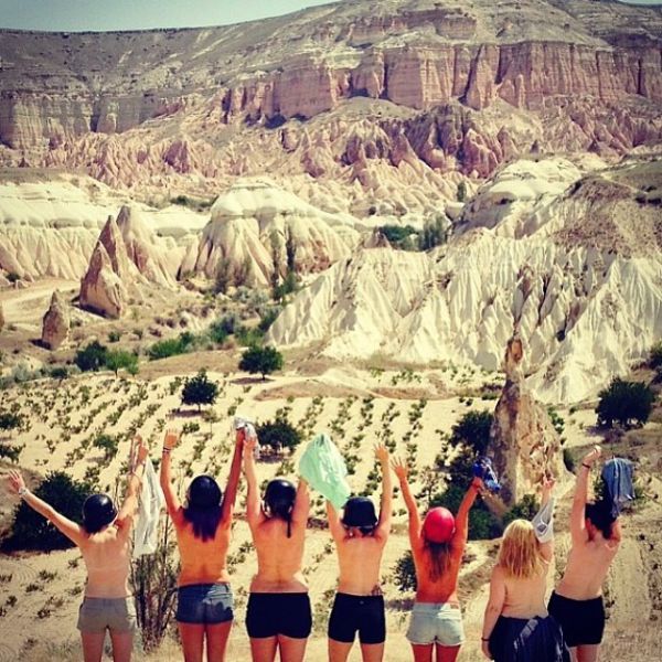 Topless Holiday Snaps Are the Newest Internet Trend