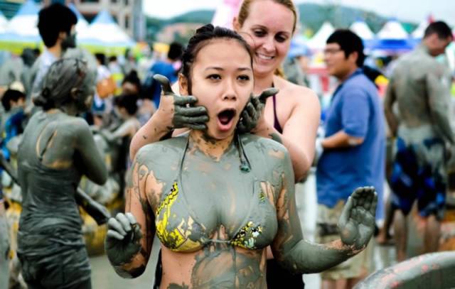 Girls Having Fun At The Korean Mud Festival